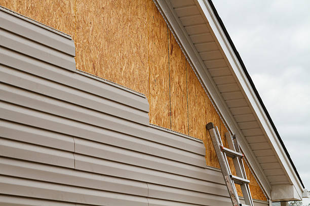 Professional Siding Installation technician working in Rockville Centre, NY
